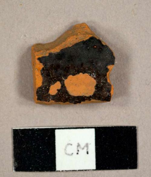 Black lead-glazed refined redware sherd