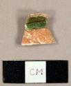 Earthenware sherd with red slip and green and cream lead glaze