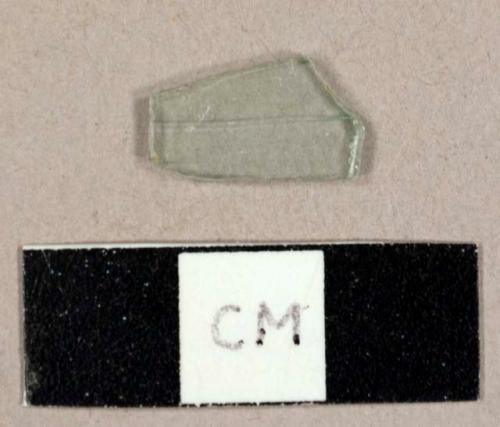 Colorless flat glass fragment, possibly window glass