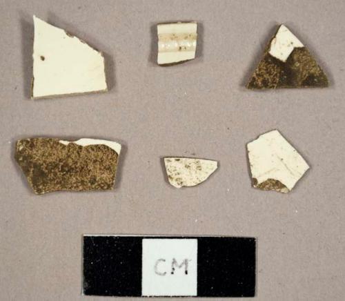 Creamware sherds, including one plate rim sherd with molded beads