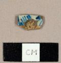 Tin-glazed earthenware sherd with blue on white handpainted decoration