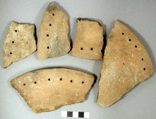 Ceramic rim sherds, fired-clouded interior & exterior, perforated along rimCeram