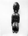 Kneeling male figure in wood