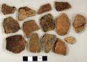 Coarse earthenware body sherds, some cord impressed, some rocker dentate, one undecorated