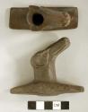 Cast of ground stone effigy pipe, animal head on platform