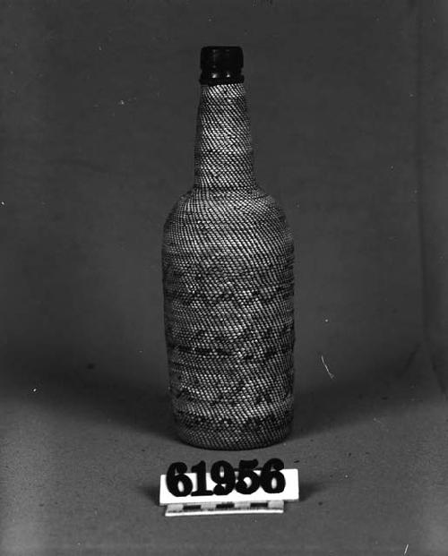 Covered bottle, bird cage weave