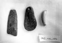 Carved slate object (56-30-20/21137) and stone pendants  (56-30-20/21135)