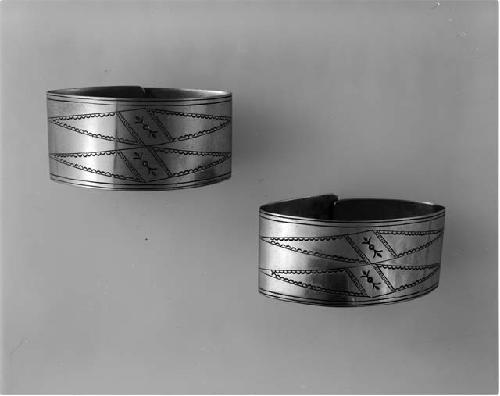 Silver bracelets with incised designs