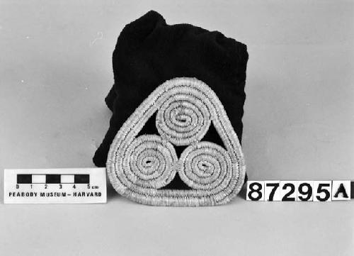 Triangular mat from the collection of E.P. Hulling, 1905-9. Close coiled.