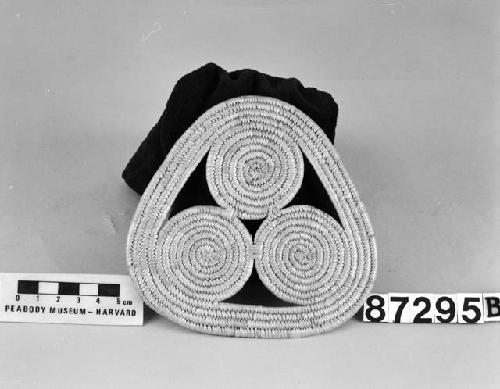 Triangular mat from the collection of E.P. Hulling, 1905-9. Close coiled.