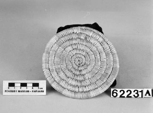 Circular mat from the collection of J. Daniels, 1902. Close coiled.