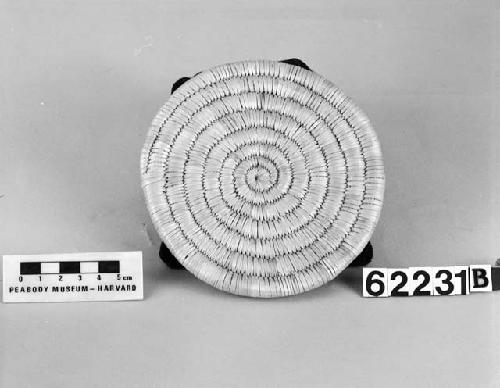 Circular mat from the collection of J. Daniels, 1902. Close coiled.