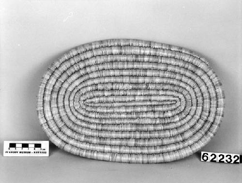 Elliptical mat from the collection of J. Daniels, 1902. Close coiled.