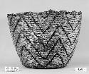 Burden basket from the collection of Father of F.H. Curtiss. Coiled, split stitches, imbricated.