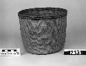 Open cylindrical basket from the collection of E.G. Fast, 1867-8. "Between weave" twined.