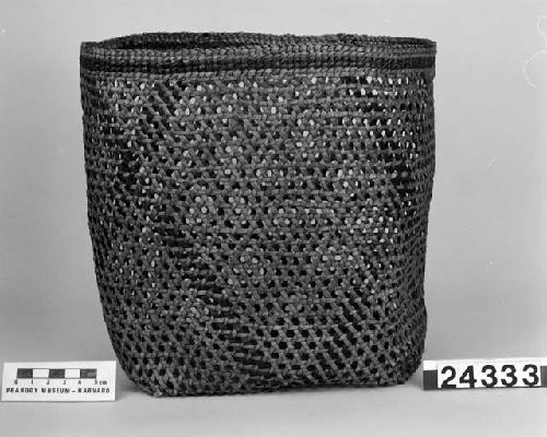 Open cylindrical basket from the collection of E. McDougall, 1891. Hexagonal plaited, twined finish.