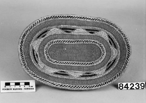 Oblong tray/mat from the collection of Lt. Woolworth ca. 1878. Plain twined, false embroidery.
