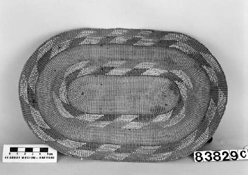 Oblong tray/mat from the collection of Lt. Woodworth ca. 1878. Plain twined, false embroidery.