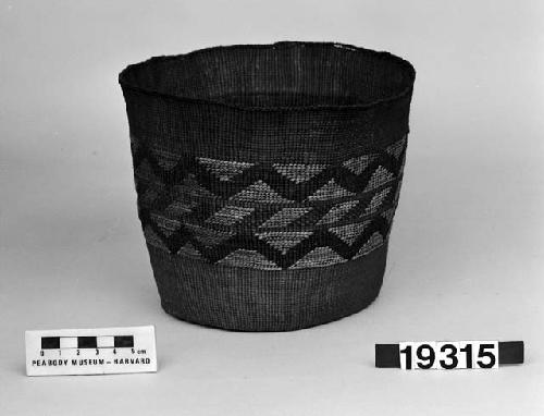 Cylindrical basket from the collection of J.S. and C.T.P. Swaim, 1900-40. Plain twined, false embroidery.