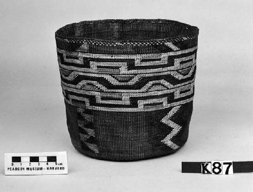 Cylindrical basket from the collection of the father of F.H. Curtiss. Plain twined, false embroidery.