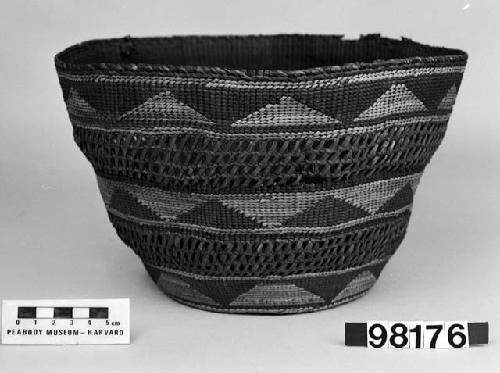 Cylindrical basket from the collection of C.A. Weare. Plain twined, false embroidery and open-twined, crossed warps.