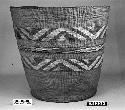 Cylindrical basket from the collection of E.H. Washlaun. Plain twined, false embroidery.