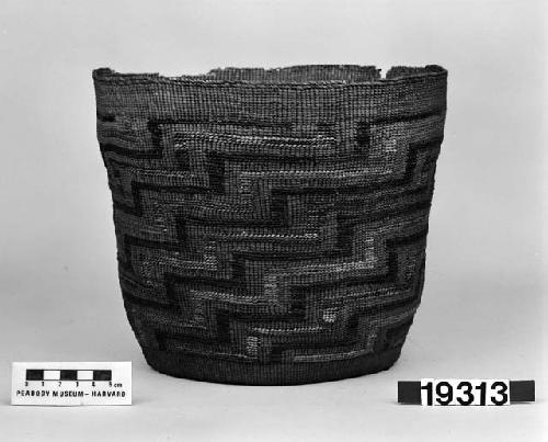 Cylindrical basket from the collection of J.S. and C.T.D. Swain, 1900-40. Plain twined, false embroidery.
