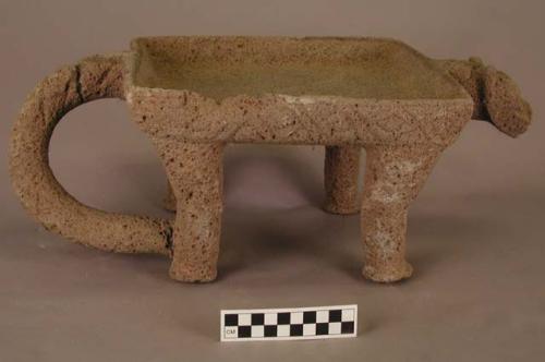 One stone effigy metate