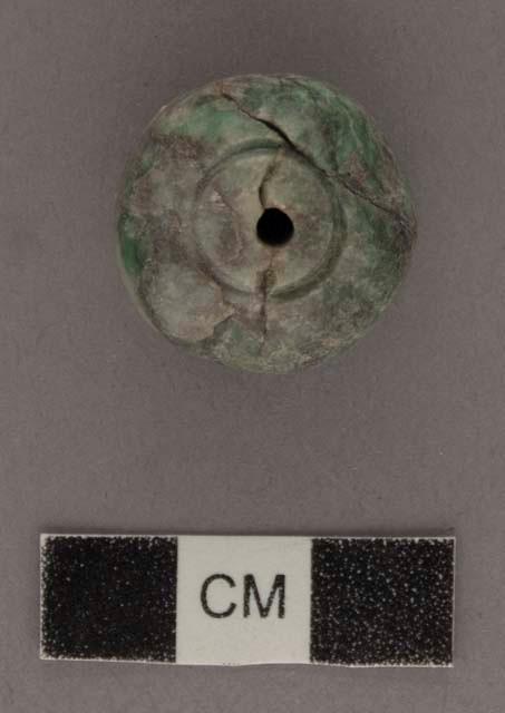 Broken spherical jade bead, grey with green blotches