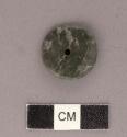 Perforated jadeite disk