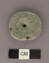 Perforated jadeite disk