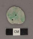 Perforated jadeite disk