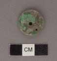 Perforated jadeite disk