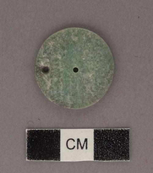 Perforated jadeite disk