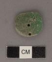 Perforated jadeite disk