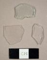 Colorless curved and flat glass fragments