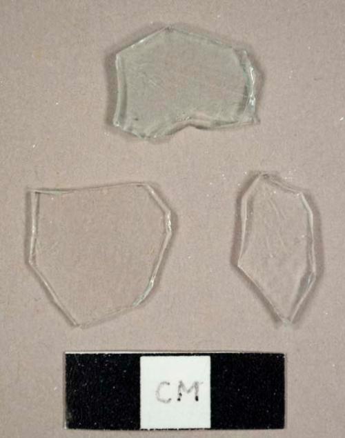 Colorless curved and flat glass fragments