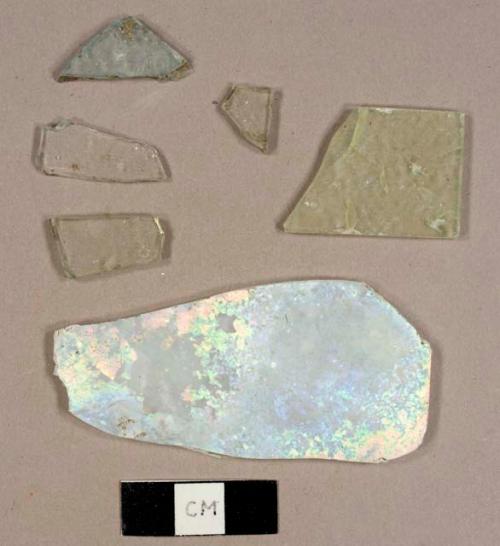 Colorless and aqua flat glass fragments, one possibly frosted