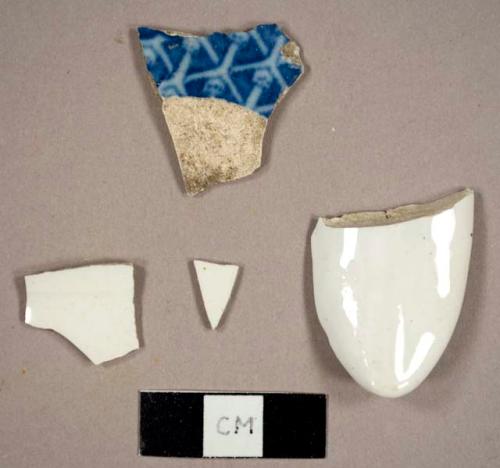 Whiteware sherds, one with royal blue transfer print, one the base of a handle to a pitcher