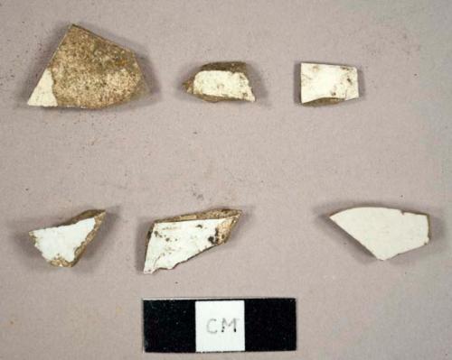 Miscellaneous ceramic sherds, including three creamware sherds, two whiteware sherds, and one English porcelain sherd