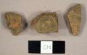 Handmade brick fragments, including one possible redware sherd