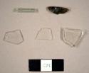 Assorted modern glass fragments, including some colorless glass fragments possibly from a lamp