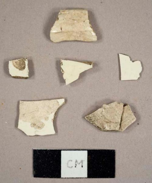 Creamware sherds, including one molded teapot handle fragment