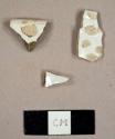 Ironstone sherds, including one possible plate rim sherd