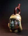 Ceramic complete vessel, stirrup spout, polychrome,  in form of human head
