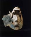 Human head in jaw of serpent (fragment)