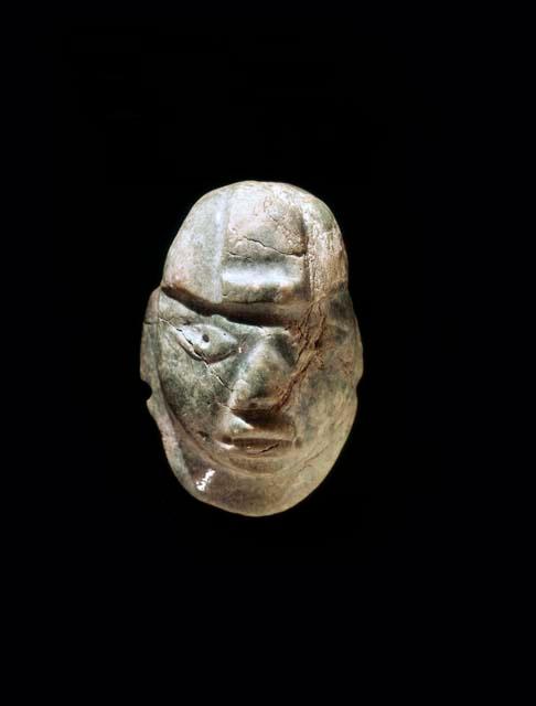 Carved jadeite ornament, human face