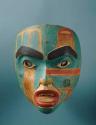 Carved and painted wooden mask, of a human face.
