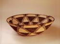 Basket tray, coiled. Made of bear grass and devil's claw. Goemetric designs.