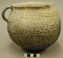 Corrugated pottery handled jar